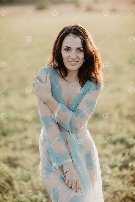 girl in underwear topless in the field in the summer stock image