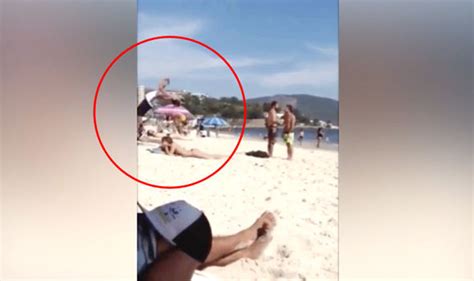 video captures sunbathing girl  huge shock  beachgoer   life life style