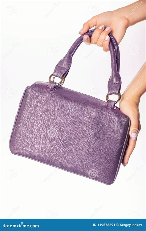 close  photo  trendy violet bag  hands  fashionable woman stock