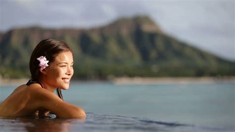 hawaii vacation wellness pool spa woman relaxing in warm