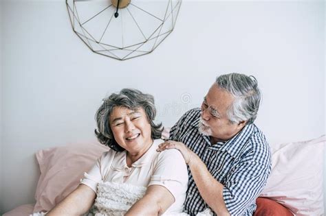 Senior Man Giving A Massage To His Wife Stock Image