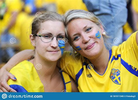 Two Soccer Swedish Girls Fans Faces Painted In Yellow Blue National