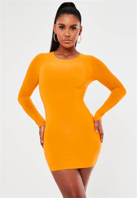orange slinky long sleeve ruched bum mini dress missguided