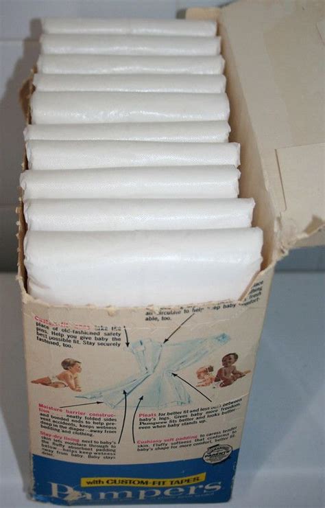 cardboard box filled  white candles  top   table