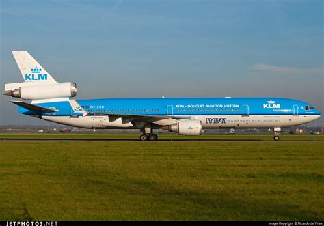 klm airplane   runway   airport  grass  blue sky   background