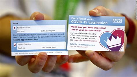 uk covid  vaccination cards  remind people     dose cnn