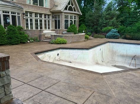 stamped concrete pool deck  custom chiseled stone cantilevered