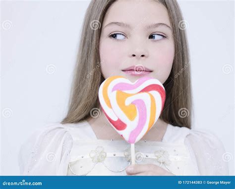 little pretty girl with big candy stock image image of hair girl