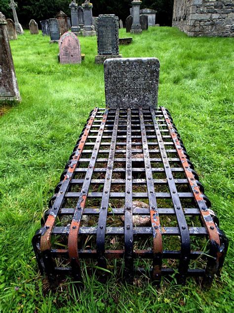metal bed sitting   middle   cemetery  headstones