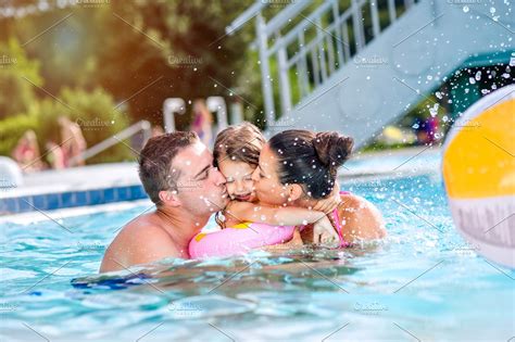 Mother Father Kissing Daughter In Swimming Pool Sunny Summer Featuring