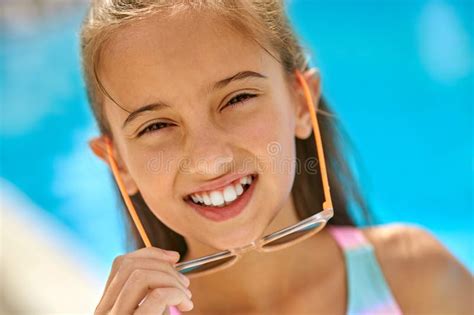 Close Up Face Of Girl With Glasses Looking At Camera Stock Image