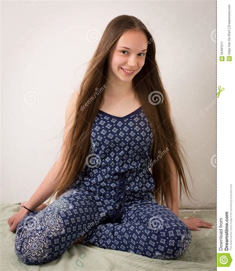 Beautiful Brunette Teenage Girl In Blue Pajamas Stock