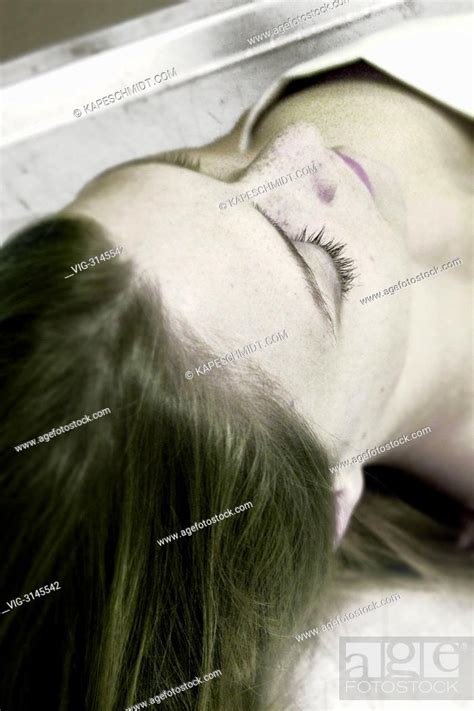 dead body   woman   autopsy table   forensic pathology posed stock photo picture