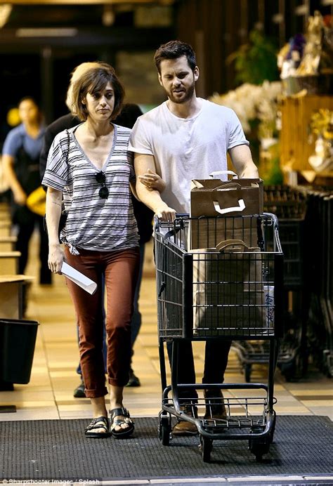 newly engaged lizzy caplan and fiance tom riley go