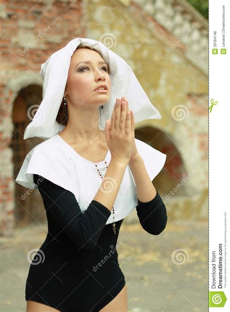 girl wearing a nun clothes praying royalty free stock