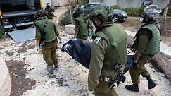 Israel kibbutz scene of “massacre"