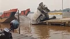 Concrete Mixer Getting Loaded on Ship Slides Off and Falls Into Water