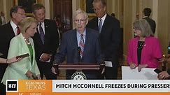 Senate Minority Leader Mitch McConnell freezes while talking to reporters