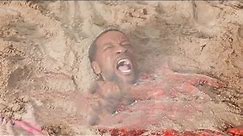 The father was buried in the sand and instantly struck by lightning.