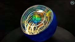 Resin sphere. Rings with acrylic paints in an epoxy resin sphere. Epoxy resin