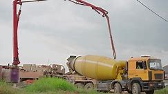 concrete truck unloads concrete at a construction site