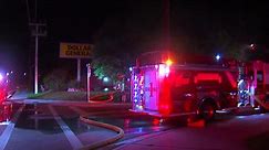 Dollar General fire continues to burn