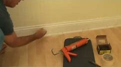 Installing baseboard trim to a concrete wall