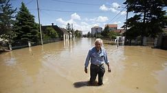 Record floods in the Balkans have killed close to 40 people and triggered as many as 3,000 landslides