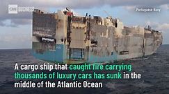 Burnt-out cargo ship carrying thousands of luxury cars sinks