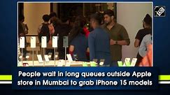 People wait in long queues outside Apple store in Mumbai to grab iPhone 15 models