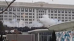 Video shows Kazakh security forces use tear gas and stun grenades at protesters