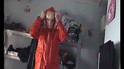 woman in a rubber .vintage rainwear orange agu raincoat