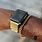Black Apple Watch with Gold Band