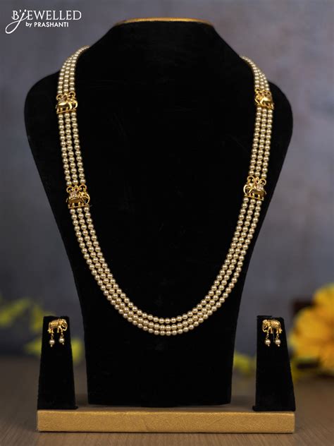 Pearl triple layer haram with elephant side pendant and ruby & cz ston ...