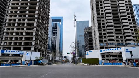 New residential towers rise alongside modern office buildings across ...