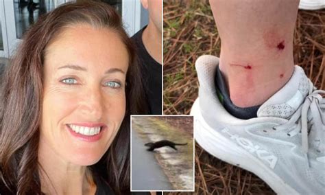Woman cheering on marathon runners attacked by furious otter that ran ...