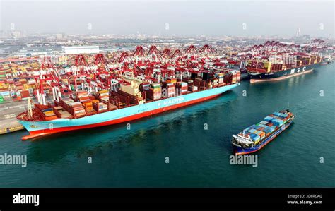 QINGDAO, CHINA - JANUARY 14, 2026 - The cargo ship is loading and ...