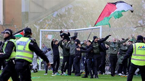 Fans clash on Ibrox pitch after Celtic knock Rangers out of cup on ...