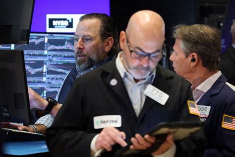 Nasdaq, S&P 500 end lower on renewed AI growth worries ahead of big tech earnings | Reuters
