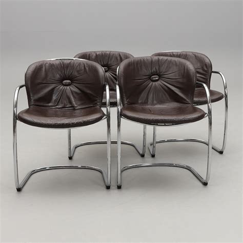 A set of four armchairs, second half of the 20th century. Furniture - Armchairs & Chairs - Auctionet