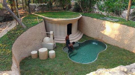 Watch two men create a secret underground hut with a grass roof for ...