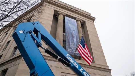 Trump's image displayed on Justice Department headquarters reflects ...