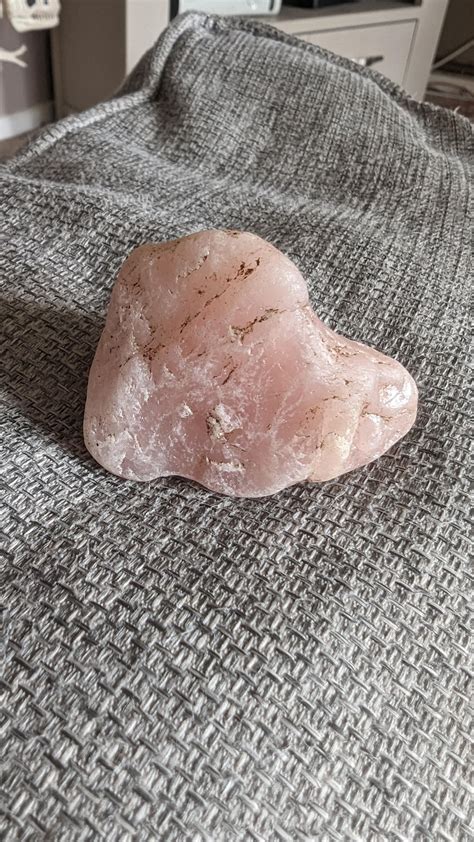 My stepdad found a pretty little chunk of rose quartz in our garden! The camera doesn't do the ...