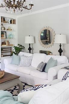 White And Aqua Living Room by White Slipcovered Sofas With Aqua And Navy Accents In White And Aqua Living Room
