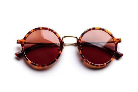 Stylish round tortoiseshell sunglasses resting on a surface showcasing ...