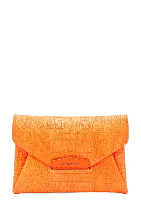 Givenchy Envelope Clutch in Orange | FWRD