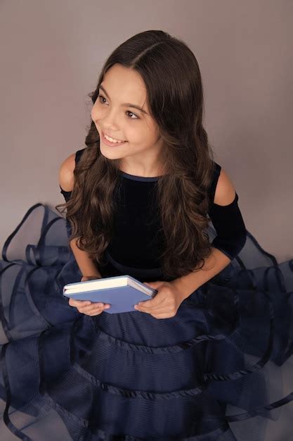 Teenager schoolgirl hold book and copybook ready to learn school ...