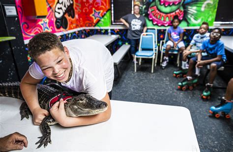 Joie Henney and Wally the emotional support alligator - pennlive.com