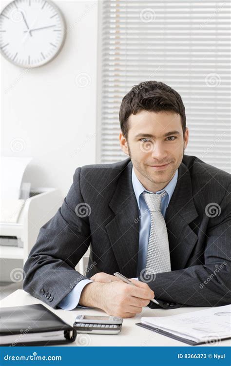 Businessman Working at Desk 的图像结果