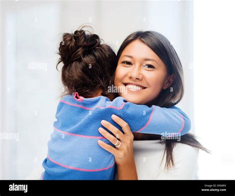 hugging mother and daughter Stock Photo - Alamy